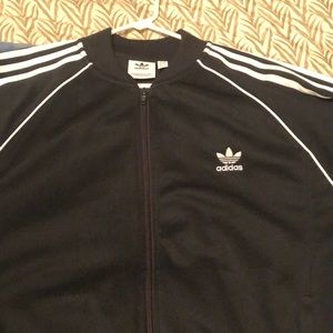 Adidas three striped zip up jacket. Size XL